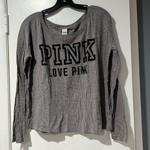 Pink long sleeve shirt, it’s on the shorter side.